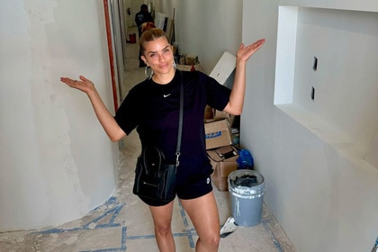 Robyn Dixon standing in her Glo Studio that is going under renovations