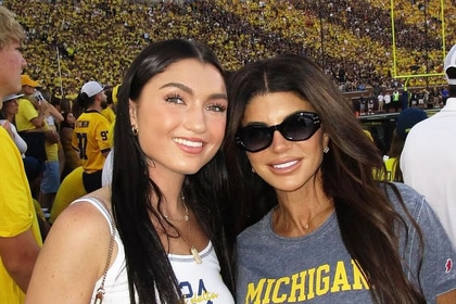 Teresa Giudice and Gabriella Giudice smiling together at a Michigan football game.