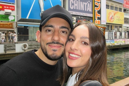 Alexia Umansky and Jake Zingerman posing together in Japan.