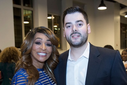 Karen Huger and Matthew Byars posing together at an event.