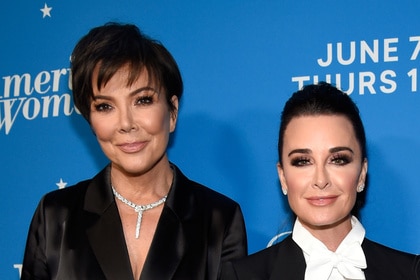 Kris Jenner standing next to Kyle Richards on the red carpet for the "American Woman" premiere party