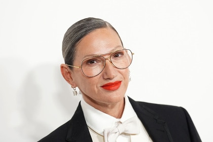 Jenna Lyons smiling in front of a step and repeat.