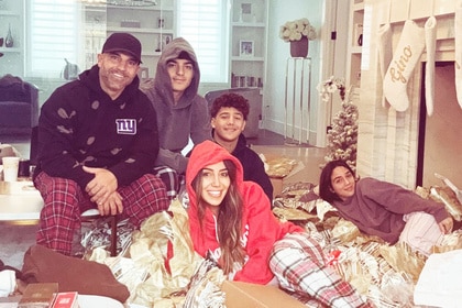 Melissa Gorga, Joe Gorga, Gino Gorga, Joey Gorga, and Antonia Gorga smiling in Christmas pajamas.