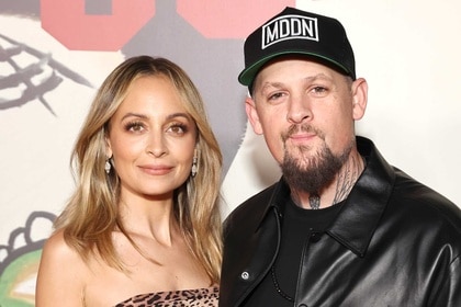 Nicole Richie and Joel Madden on a step and repeat for the Carlos Eric Lopez's Fourth Annual Día de Muertos Gala