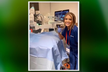 Salley Carson in scrubs during a surgery in a hospital