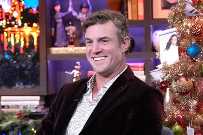 Shep Rose smiling while sitting as a guest on Watch What Happens Live