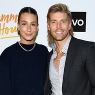 Amanda Batula and Kyle Cooke smile together on the red carpet of the Summer House Season 8 Premiere Party