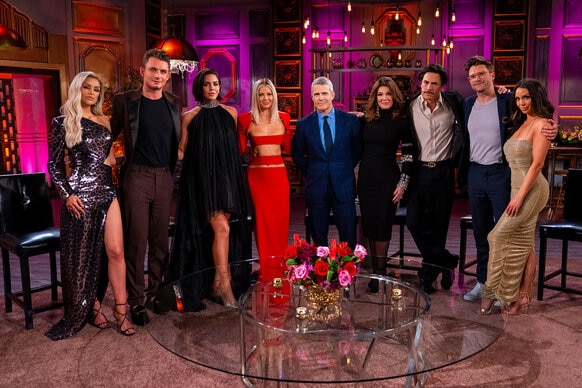 Lala Kent, James Kennedy, Katie Maloney, Ariana Madix, Andy Cohen, Lisa Vanderpump, Tom Sandoval, Tom Schwartz, and Scheana Shay pose at the Vanderpump Rules reunion.