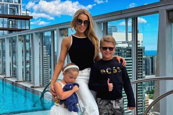 Lisa Hochstein of The Real Housewives of Miami poses with her children on a high rise on Instagram.