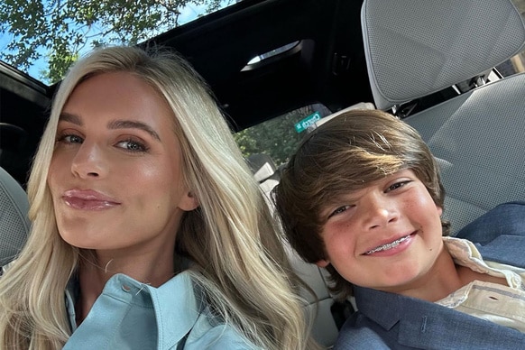 Madison Lecroy and Hudson Hughes smiling together in a car.