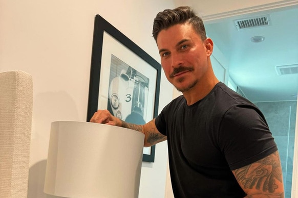 Jax Taylor working on a lamp in his new home