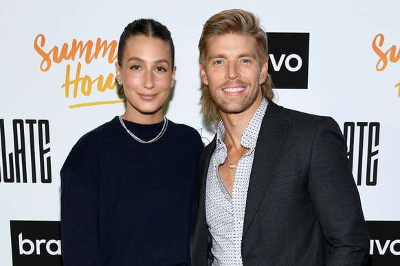 Amanda Batula and Kyle Cooke smile together on the red carpet of the Summer House Season 8 Premiere Party