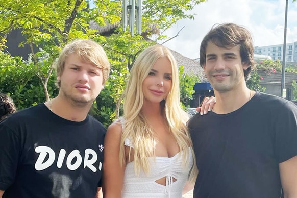 Alexia Echevarria Nepola, Frankie Rosello, and Peter Rosello posing together outside.