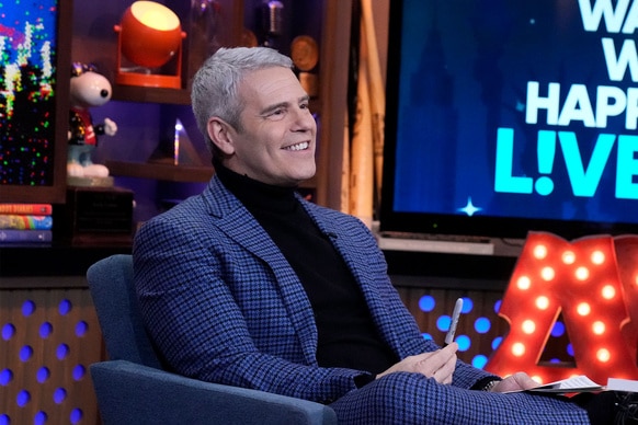 Andy Cohen smiling at the Watch What Happens Live clubhouse in New York City.