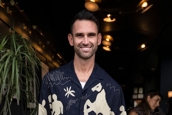 Carl Radke weraing a graphic pattern shirt at an event in NYC