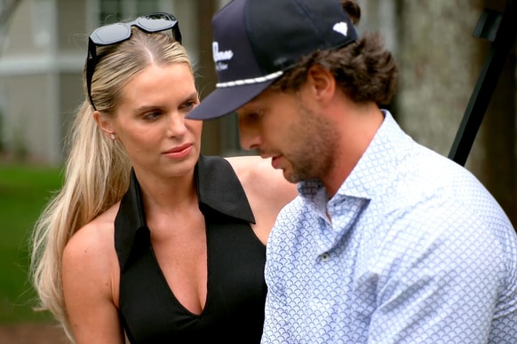 Madison Lecroy wears a black halter while with her husband Brett Randle, they are having a conversation together