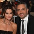 Kyle Richards and Mauricio Umansky smile together in formalwear.