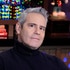 Andy Cohen sitting at the Watch What Happens Live clubhouse in New York City.