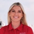 Carrie O'Neill smiling on the Mustique yacht in her uniform.