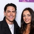 Tom Sandoval and Victoria Lee Robinson posing in front of a step and repeat.