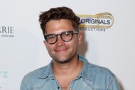 Tom Schwartz wearing a denim shirt while on the arrivals carpet for grand opening of The House of Barrie home goods store.