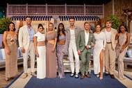 The Summer House cast posing together in front of a themed set.
