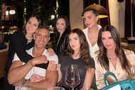 Mauricio Umansky with all his daughters and Kyle Richards at a restaurant