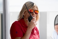 Captain Sandy Yawn talking into a walkie talkie onboard the Mustique yacht.