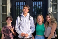 Alexis Bellino posing with Miles Bellino, James Bellino, and Mackenna Bellino on their doorstep.