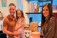 Jesse Lally, Michelle Lally, and Isabella Lally posing together at a birthday party.
