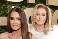 Kyle Richards and Kathy Hilton posing together in front of a step and repeat.