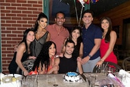 The Giudice family and the Ruelas family celebrating Nicholas Ruelas' birthday with a birthday cake.