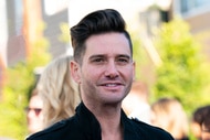Josh Flagg wearing a black jacket at an outdoor event in Los Angeles