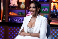 Caroline Brooks wearing a white pant suit at Watch What Happens Live
