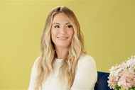 Kate Chastain smiling in front of a lime green backdrop.