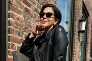 Katie Maloney on a balcony wearing a black leather jacket