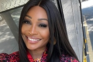 Cynthia Bailey smiling outdoors.