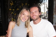 Jessica Stocker and Jacob Fowler smiling together at a restaurant.