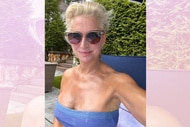 Dorinda Medley wearing a blue bathing suit and sunglasses in her backyard