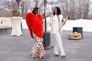 Bronwyn Newport and Lisa Barlow walking outdoors together.