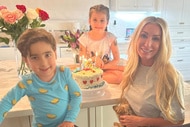 Heather Altman, Lexi Altman, and Ace Altman posing together and smiling in their kitchen.