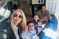 Josh Altman and Heather Altman with their children at a restaunt