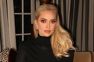 Erika Jayne wearing a black dress sitting in her living room.