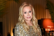 Kathy Hilton wearing a gold dress at an oscars party