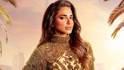 Sara Al Madani wearing a gold gown.