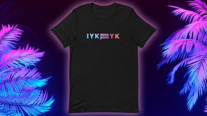 A black Tee shirt with the letters "IYKYK" on it and neon palm trees on it.