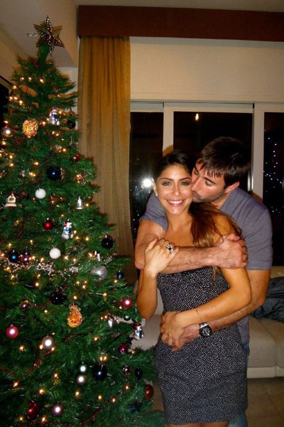 Taleen Marie standing next to a Christmas tree.