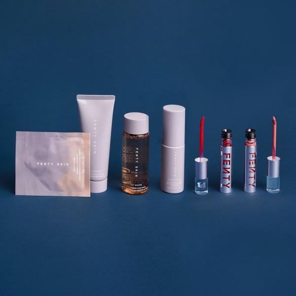 Fenty beauty products on a blue background