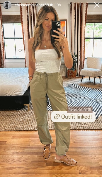 Full length of Chelsea Meissner wearing a white top and khaki pants.