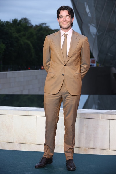 John Mulaney wears a brown suit at the Prelude to The Paris Games